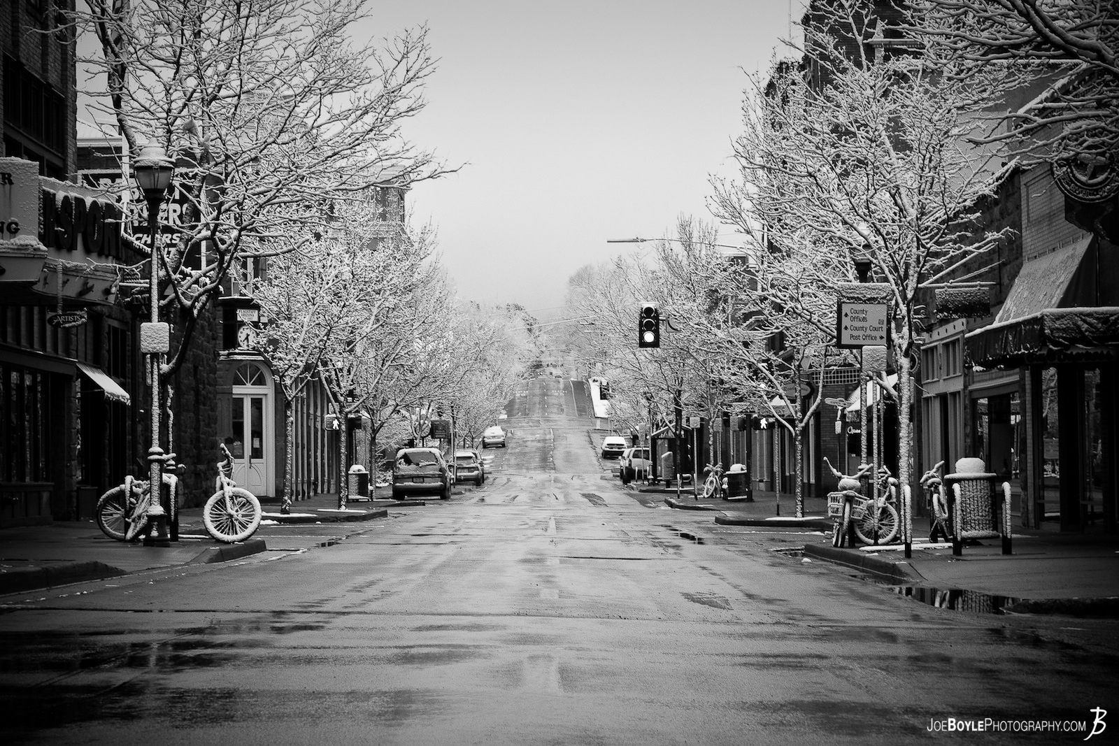  This image has won 4 awards on Pixoto.com! One of which was for being in the top 10% of all images submitted throughout 2012! I captured this image after a surprise snowfall in downtown Flagstaff. Caught in the morning hours on a weekend lended itself to very little street traffic! 