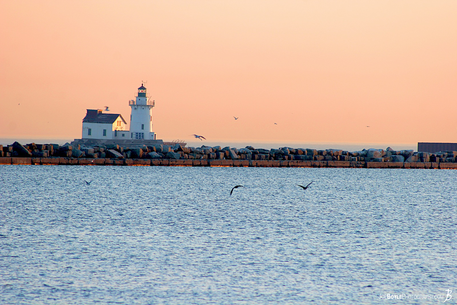  I captured this image in the early morning hours when I was actually trying to take a picture of the Cleveland Skyline. As I was shooting towards the city I turned around and saw this! The lighthouse is located off the shore of Lake Erie in Cleveland, Ohio. 