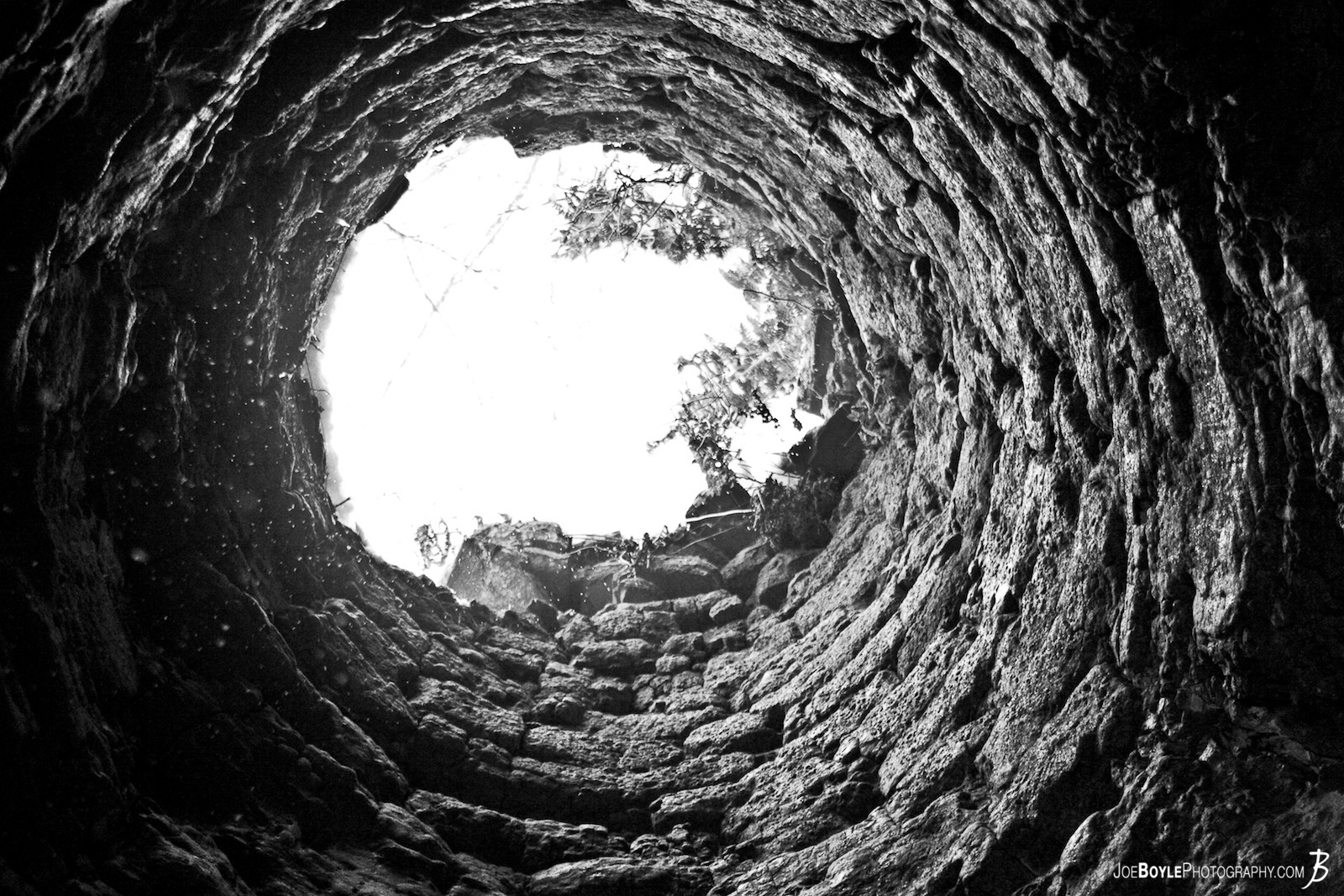  Looking up through the Chimney of an Old Iron Ore Furnace. While hiking a trail in PA I discovered this old Iron Ore Furnace. It was used during the 1900s and has been left to erode itself into a pile of romantic rubble. 