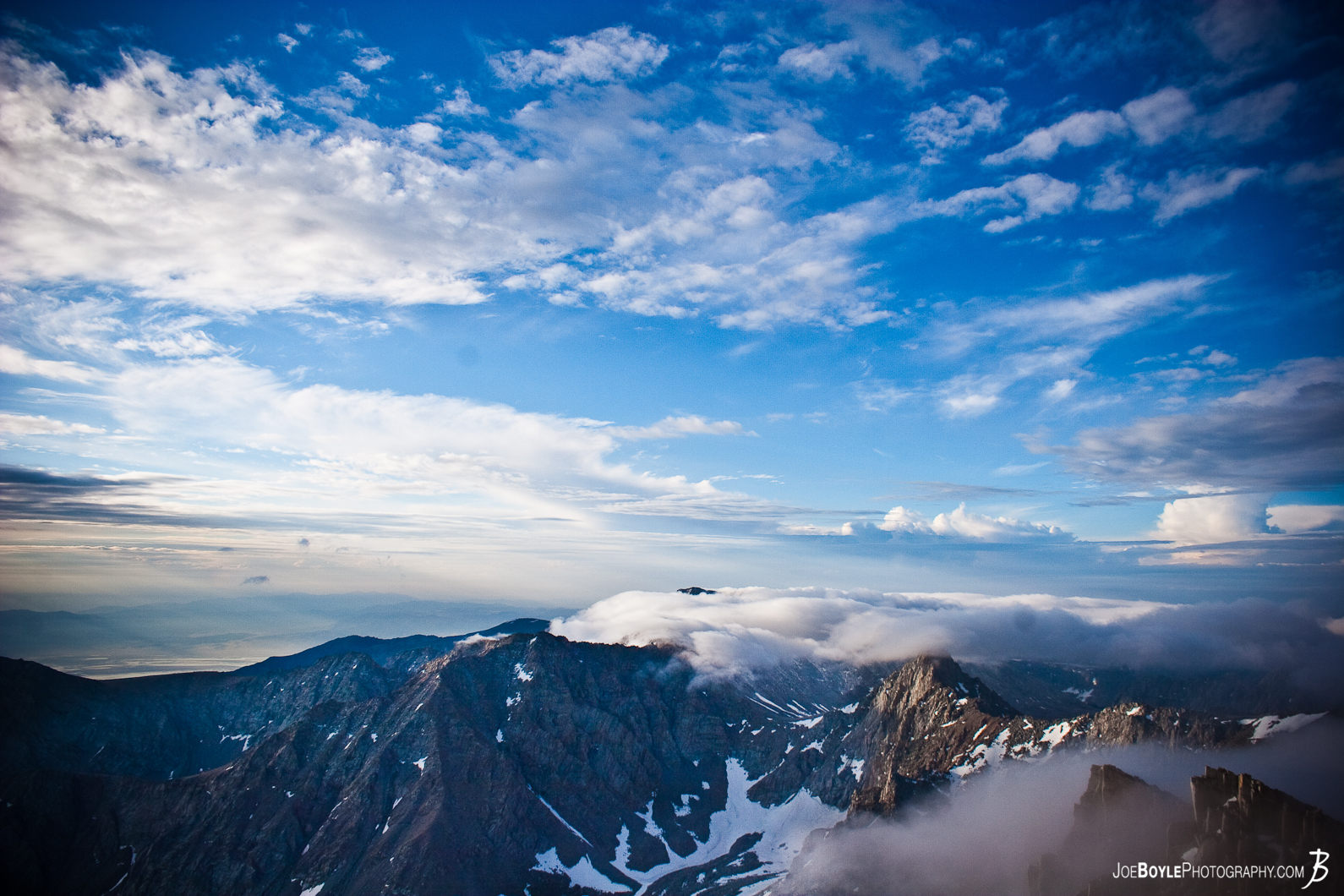  This photo is a view of the sky and tips of the surrounding mountain peaks, soon after we summited Mt. Whitney. 