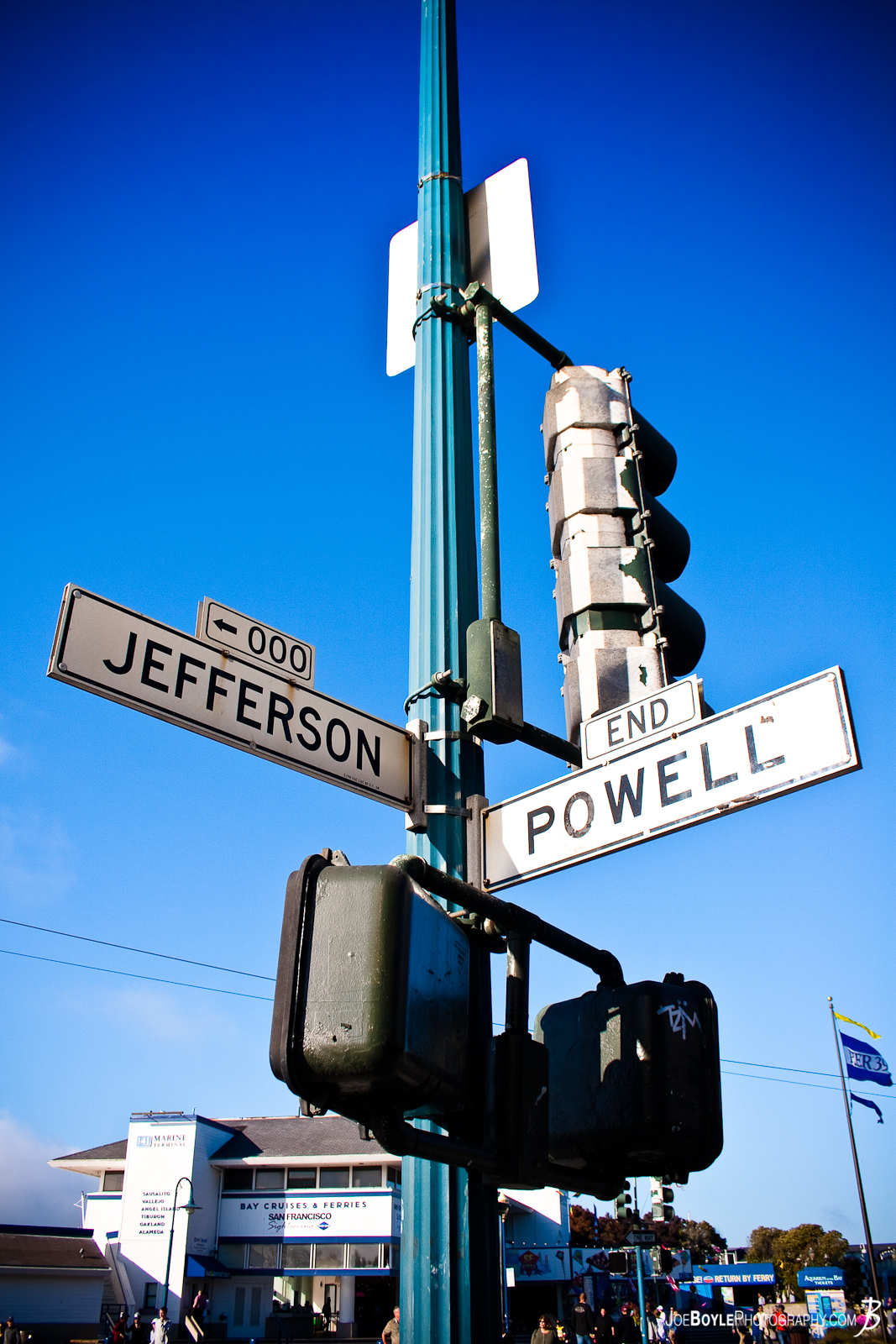  The intersection of two streets in San Francisco. I only had about 9-10 hours in San Francisco and I was walking all around the city. I like this image because it reminds me of a little piece of what \every day\ looks like to pedestrians, drivers and the like in the Bay area. 