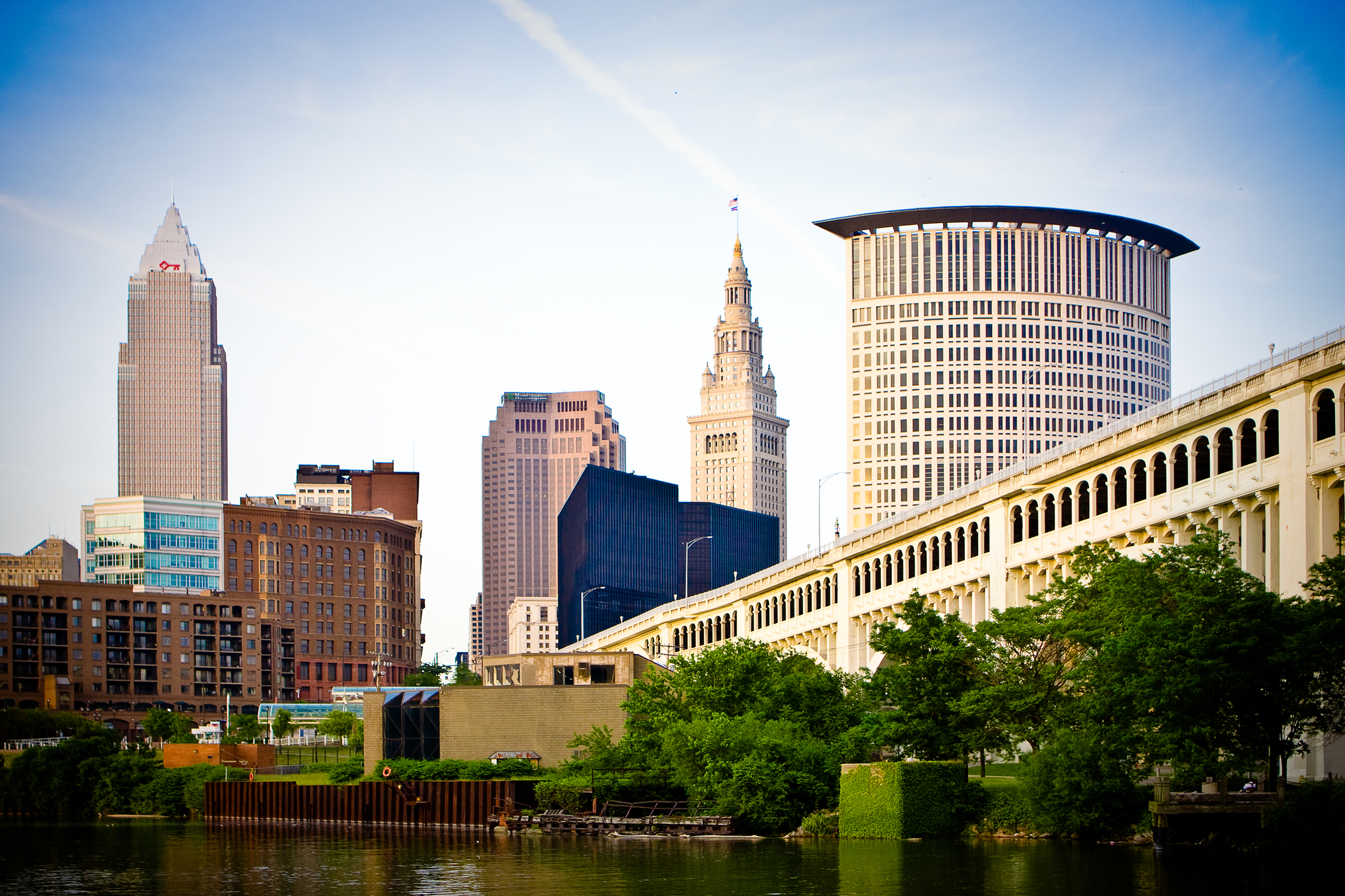  A photo of the Cleveland Skyline with the Veterans Memorial Bridge and Cuyahoga River. From left to right the 4 tallest buildings are The Key Tower, The BP-Huntington Building, The Terminal Tower and The Justice Center. 
