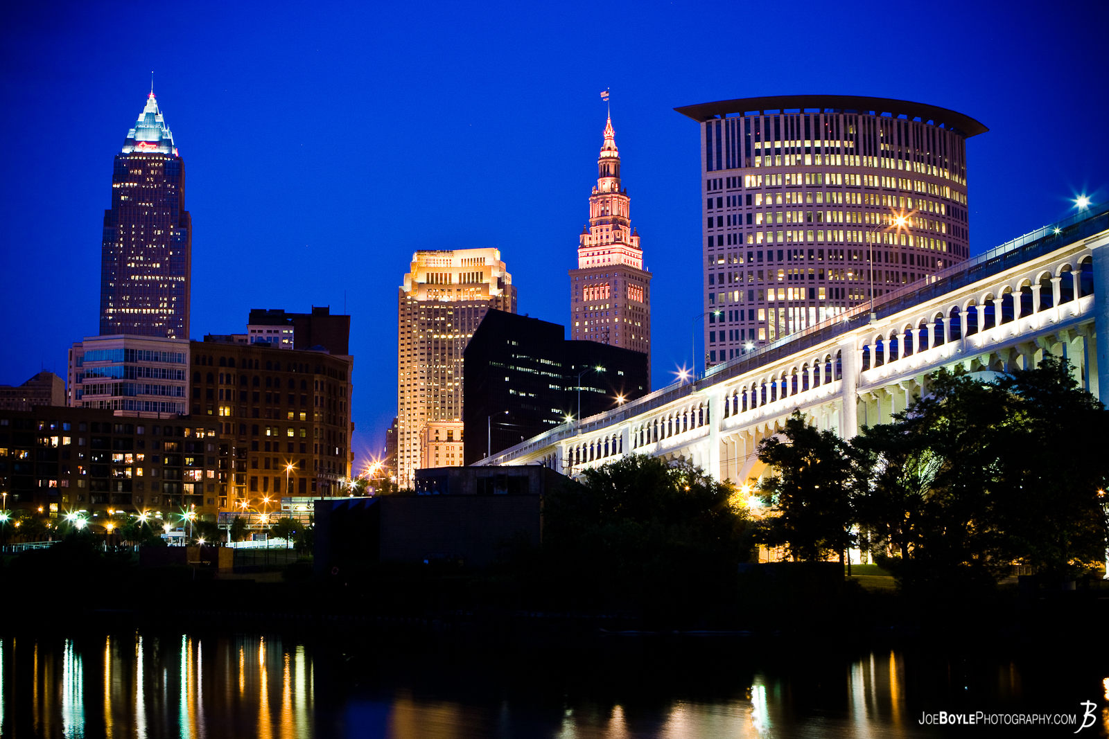  This photo is of the Cleveland Skyline with the Veterans Memorial Bridge and Cuyahoga River in the foreground. From left to right the 4 tallest buildings are: The Key Tower, The BP-Huntington Building, The Terminal Tower and the Justice Center. 