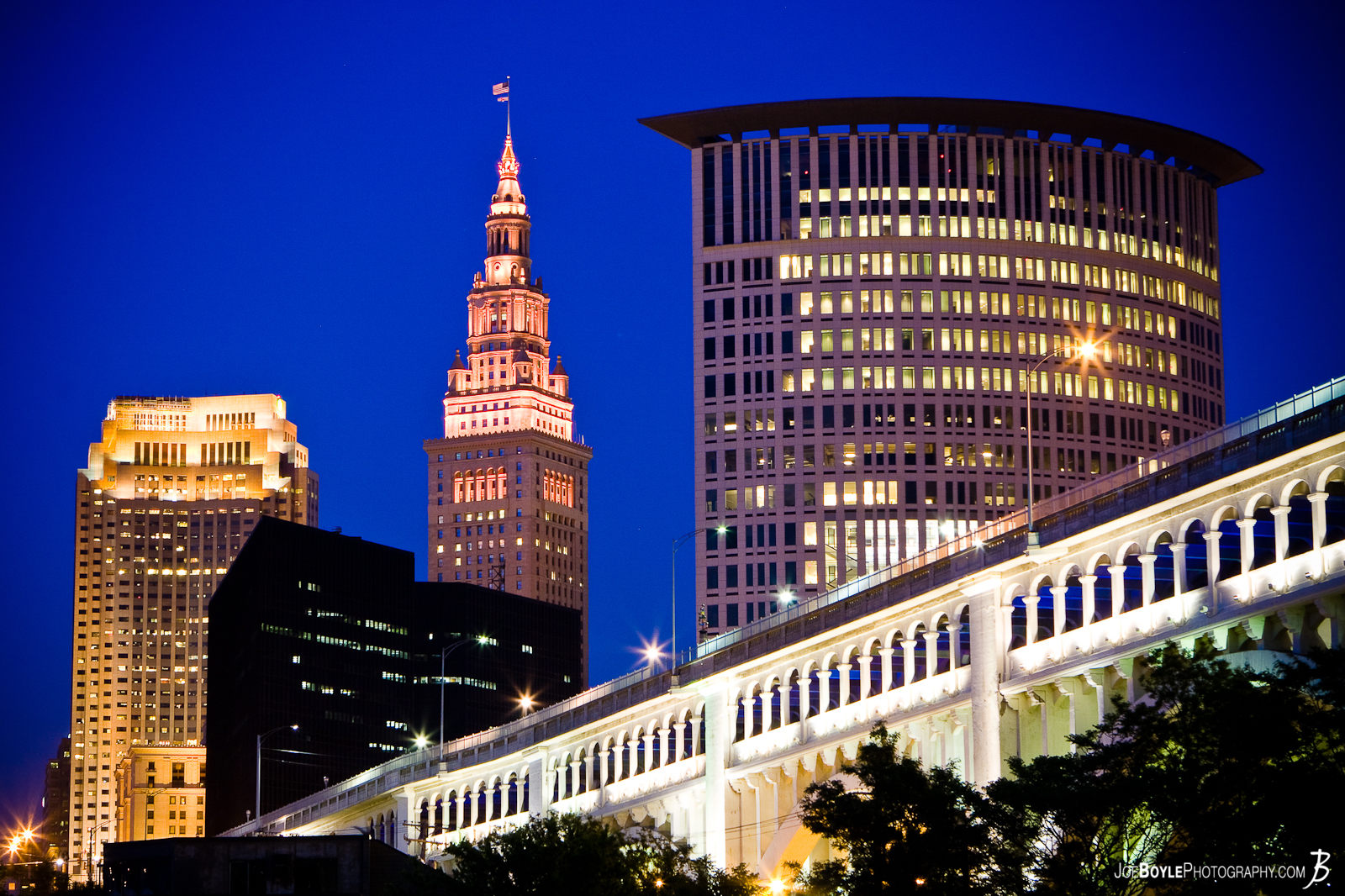  This photo is of the Cleveland Skyline with the Veterans Memorial Bridge. From left to right the 3 tallest buildings are: The BP-Huntington Building, The Terminal Tower and the Justice Center. 