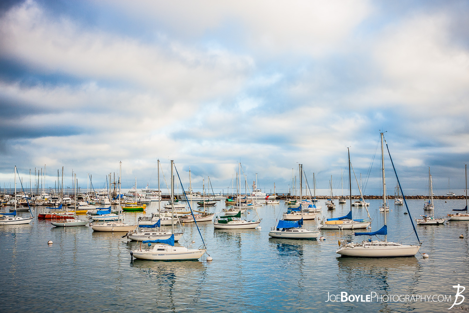  When I was traveling to Monterey, California I spent a lot of time just walking around the city, Pacific Grove and the sand dunes in the area. This is a shot of the bay and sailboats near Fisherman's Wharf and Cannery Row in Monterey! 