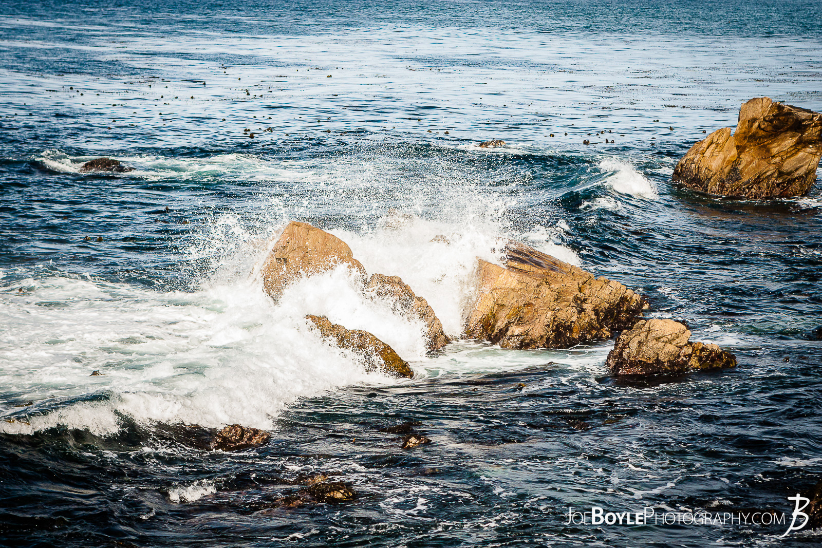  I was traveling down the 17 Mile drive to Carmel by the Sea with some friends and we made a couple pit stops along the way. This is a photo near the coast where the wind was picking up creating waves that were splashing on the rocks! 