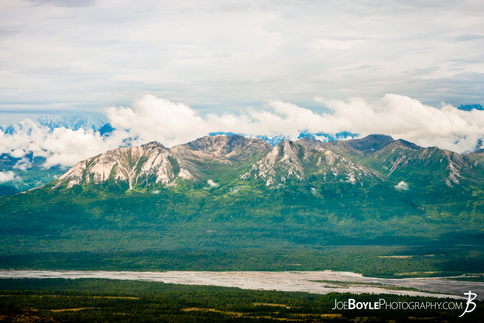  Here is a cool photo of the Alaska mountain range as seen from the Kesugi Ridge Trail. As we hiked the Kesugi Ridge trail, our view of the Alaskan mountain kept changing which provided some really cool views. Somewhere, tucked behind those clouds Mount McKinley is hiding! 