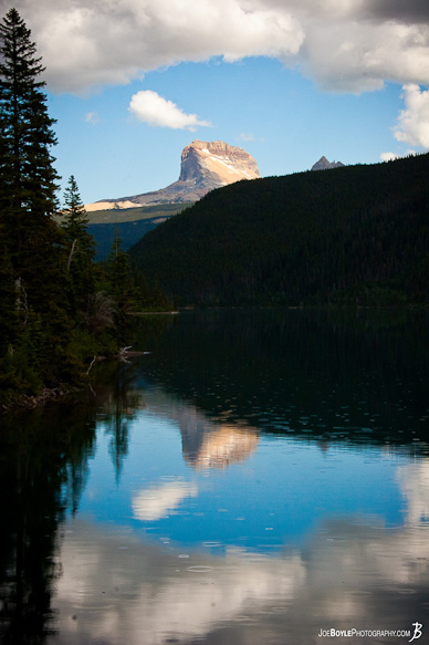 It was just beginning to rain but I was able to capture this image with the mountain being reflected in the nearby lake.