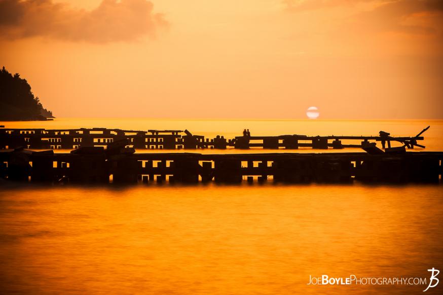 A beautiful sunset off the coast of Lake Erie with a pier in the foreground. This image was capture in Cleveland Ohio, specifically near Edgewater Park. 