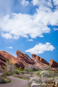 red-rocks-in-colorado-canyon-with-road-big-sky