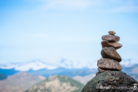 rocky-mountains-with-a-cairn-in-the-foreground