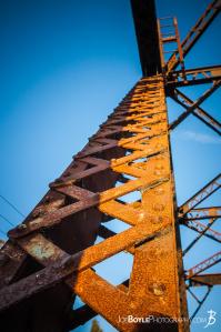 looking-up-an-iron-girder-pylon-on-a-train-bridge-color