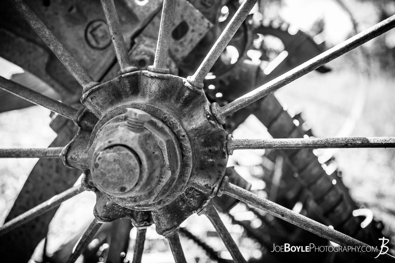 close-up-of-abandoned-farming-equipment-on-the-west-rim-trail-in-zion-national-park-wheel-spokes-axle-black-white