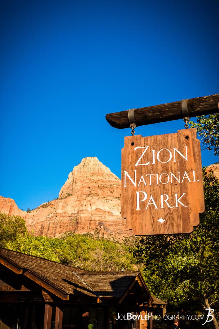 entrance-sign-of-zion-national-park-with-canyon-in-the-background-ii-portrait