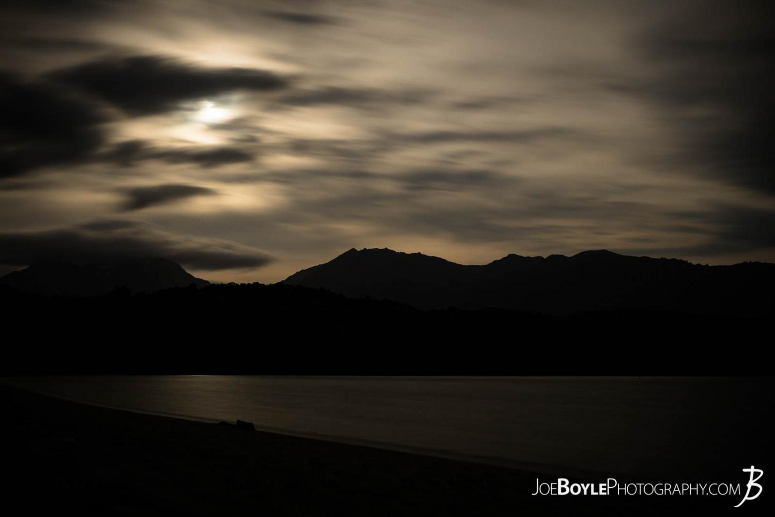 Here is a long exposure night-shot of the moon over the mountains with some cool clouds!